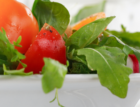 Healhty salad in white bowl